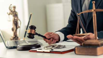 Lawyer working with scale of justice on table, law, court, judge, balance, symbol, judgment, power, court scale, power symbolizes judgment with hammer and injustice.