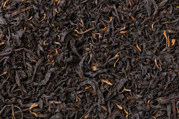 Dried black tea leaves texture background, Close up, Top view