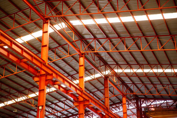 Obraz premium factory indoor steel structure industrial roof construction metal architecture inside interior iron modern large building warehouse.