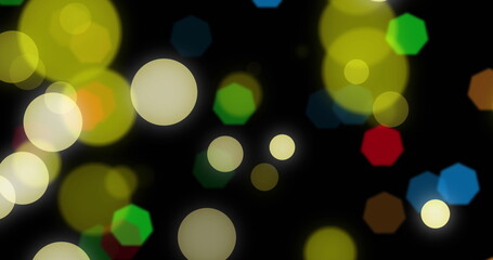 Image of christmas fairy lights flickering over black background
