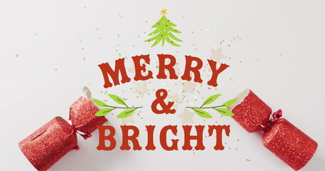 Image of christmas greetings text over christmas crackers decorations © vectorfusionart