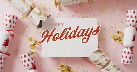 Image of christmas greetings text over christmas crackers decorations © vectorfusionart