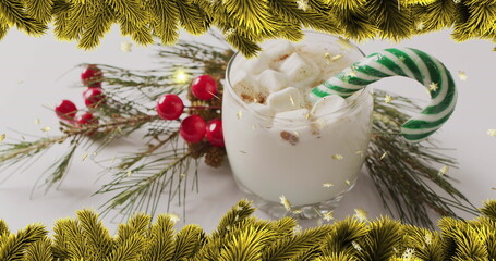 Fototapeta premium Image of stars falling over christmas drink and decorations