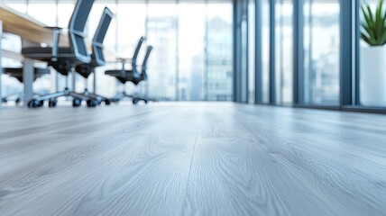 Flooring vinyl maintenance concept. Modern office interior featuring a polished wooden floor with chairs and large windows creating a bright atmosphere.