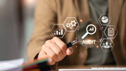 Accountant showing office document auditing concept ,plan review process and assess correctness...
