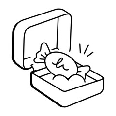Sweet candy in a box icon in doodle style 


