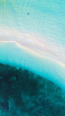 Aerial view of coral reef with turquoise water in Maldives