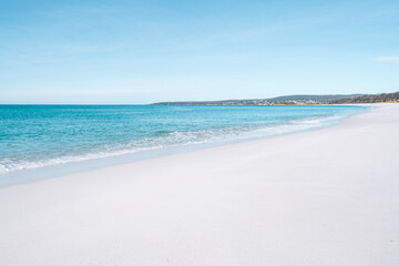 Sandy beach with sky and clouds