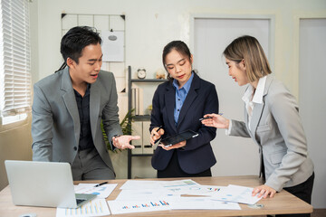 Asian business Talk about new projects, presents at home office.
