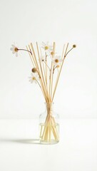 A delicate reed diffuser with white dried flowers, showcasing softness and charm, perfect for bedroom or relaxation settings.