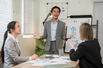 Asian business Talk about new projects, presents at home office.
