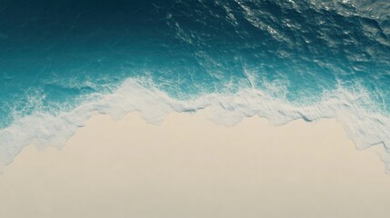 Aerial view of ocean waves meeting a sandy beach, showcasing natural beauty and tranquility.
