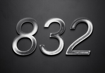 Chrome metal 3D number design of 832 on grey background.