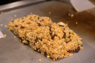 Delicious fried rice with meat being cooked fresh.