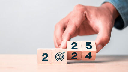 Flipping Wooden cube block for change 2024 to 2025, Countdown to 2025. Loading year from 2024 to...