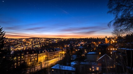 Fototapeta premium Twilight cityscape panorama: A mesmerizing view of a city bathed in the warm glow of twilight, with stars beginning to appear in the darkening sky.