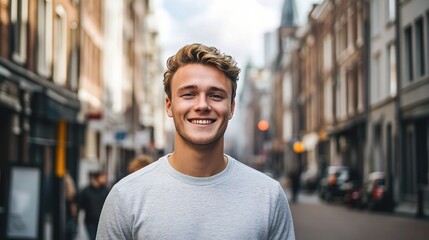 Young Man in Casual Attire Standing Confidently on City Street