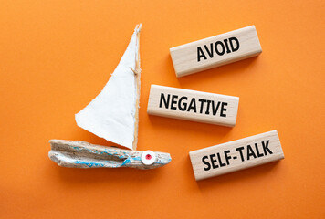 Avoid negative self-talk symbol. Concept words Avoid negative self-talk on wooden blocks. Beautiful...