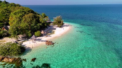 Experience the serene escape to Koh Munnork Island in Thailand, where soft sandy beaches meet turquoise waters. Explore lush landscapes and enjoy the tranquil ambiance of this island paradise.