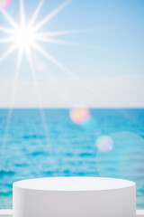 Obraz premium white cylindrical display platform by the sea