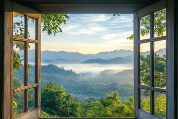 Open window with view of beautiful landscape, misty morning light on the mountains in Thailand.
