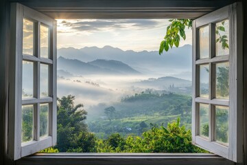 Open window with view of beautiful landscape, misty morning light on the mountains in Thailand.
