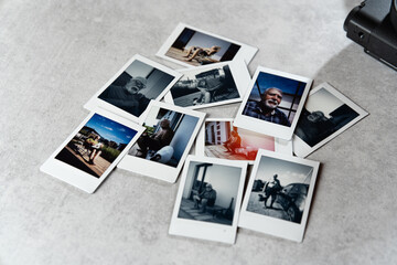 Collection of vintage polaroid photographs on a textured surface