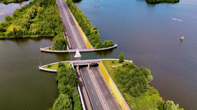 Witness the remarkable Veluwemeer Aqueduct, an engineering marvel that allows vehicles to cross under water. Located in the beautiful Dutch landscape, this structure highlights innovative design.
