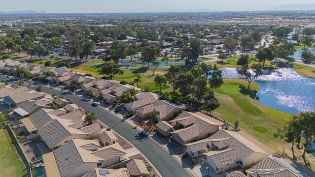 Aerial view of suburban neighborhood with golf course.