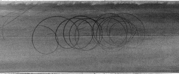 Aerial top view car tire mark from car skid mark, Car tire on asphalt road race track, Texture and background car wheel tire mark on asphalt road © Kalyakan