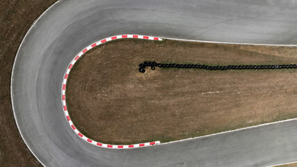 Aerial view race go-kart track, Track for auto racing top view, Car race asphalt and curve street circuit, Go-kart winding race track. © Kalyakan