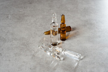 Vaccine ampoules for virus prevention placed on a sterile surface