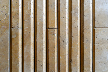 Textured wooden wall with vertical grooves, showcasing natural patterns and earthy tones. warm colors create calming atmosphere, perfect for interior design inspiration