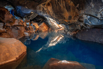The Grjótagjá cave in Iceland’s Mývatn region features striking blue water within its depths