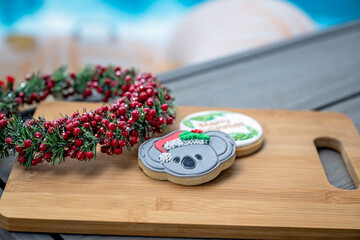 Christmas Australia cookies biscuits on platter by swimming pool, Australian festive season concept, sunny outdoors day