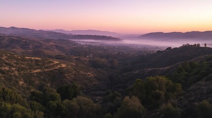 Serene Sunrise Over Misty Valley Hills