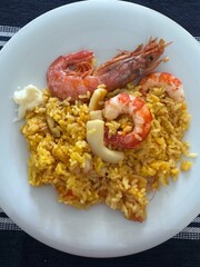 Paella Spanish food on white plate