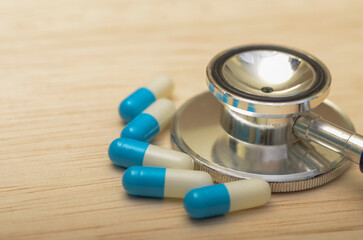Healthcare Essentials: Stethoscope and Pill Capsules for Medical Care Concepts
