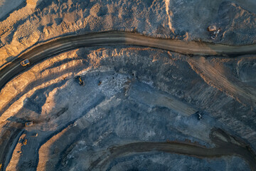 Panoramic of open pit mine industry, aerial view. Big yellow mining truck for coal working in quarry