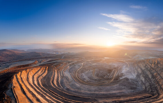 Panoramic of open pit mine industry, aerial view. Big yellow mining truck for coal working in quarry