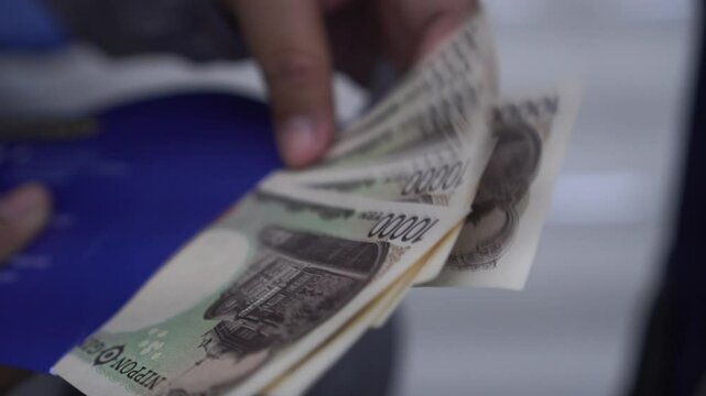 JPY money Japanese Yen banknote Counting in Business people hands for paying shopping salary or payment services, Cash Tax, saving cash for economy finance bill