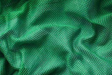 Crumpled green mesh textile background