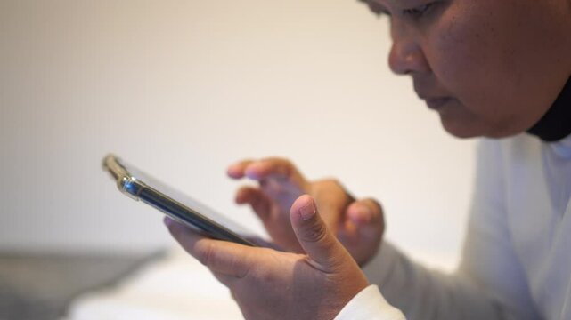 Asian Woman using mobile phone with smiling happiness at restaurant, Use smartphone checking document report presentation corporate working