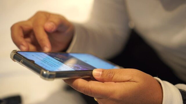 Asian Woman using mobile phone with smiling happiness at restaurant, Use smartphone checking document report presentation corporate working