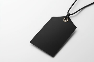 Premium black tag for clothing fashion industry product photography minimalist environment close-up view branding concept