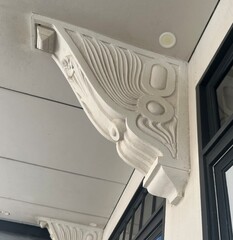 Art deco corbel on the outside of a commercial building © Rose Makin