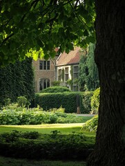 Obraz premium Tranquil Park Scene with Tree Tunnel and Victorian Mansion