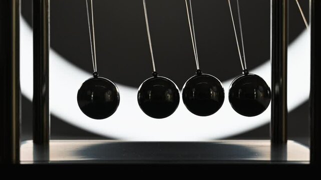 balance balls, balance balls swinging in backlight