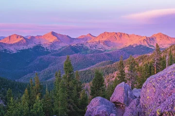 Fototapeten Scenic mountain landscape at sunset with vibrant colors and trees. © Frame