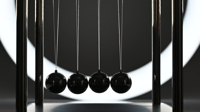 balance balls, balance balls swinging in backlight